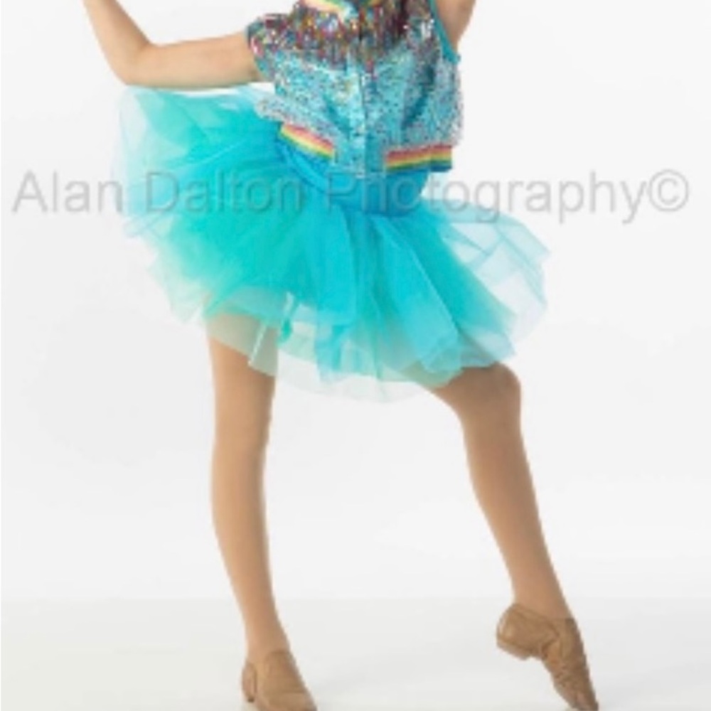 Blue dance costume and rainbow jacket